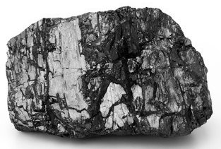 Ein großer, unregelmäßig geformter Stein mit dunklen und hellen Flecken.