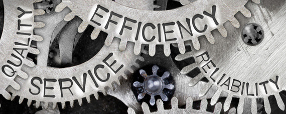 Ein mechanisches Ganzes aus ineinander greifenden Zahnrädern mit den Schriftzügen 