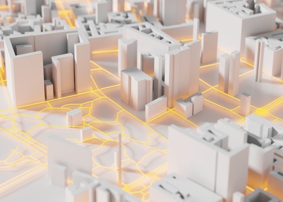 Eine digitale Darstellung einer Stadtlandschaft mit weißen Gebäuden und orangefarbenen Lichtlinien, die Verbindungen darstellen.