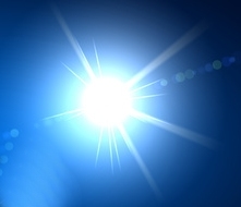 Ein helles, blendendes Lichtstrahlmuster auf einem blauen Hintergrund.